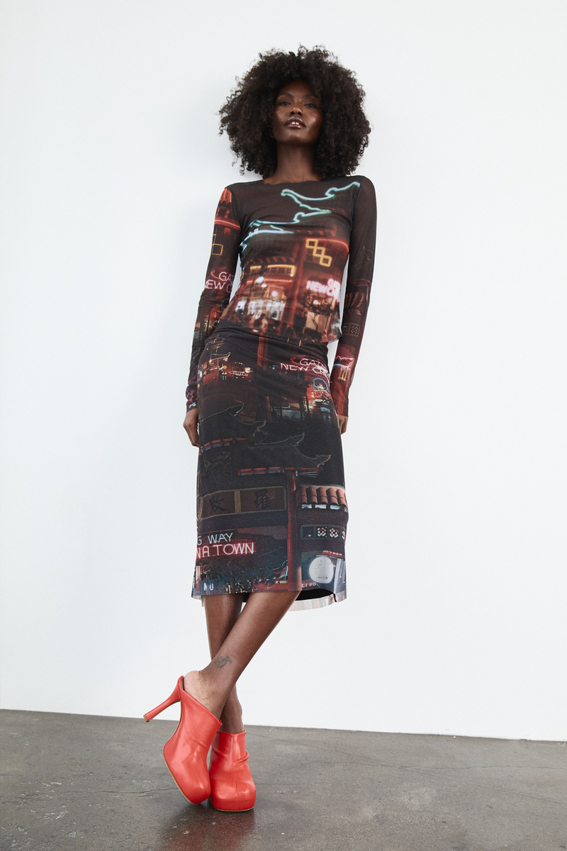 Grover Rad Gateway Mesh long sleeve top and midi length skirt featuring a chinatown print with black background