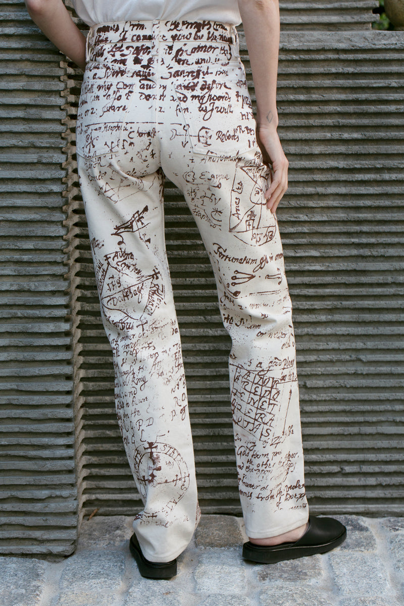 Shop jeans. Silk screened denim pants with historical script print